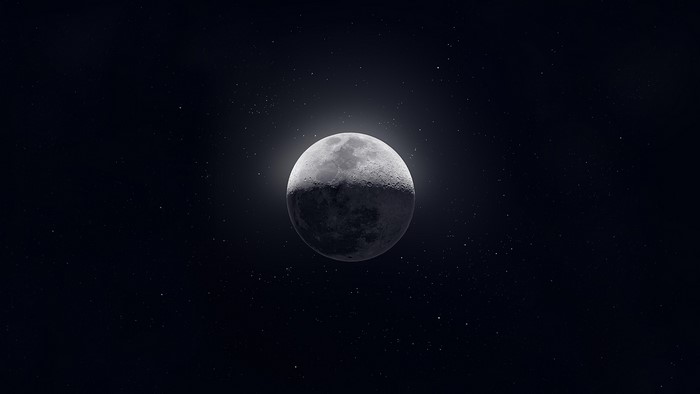 The Moon in space with stars