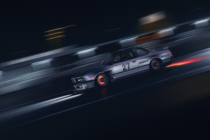 Silver BMW E24 M635CSi racing at night