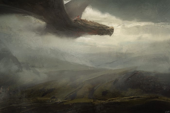 A person rides a dragon over a misty landscape