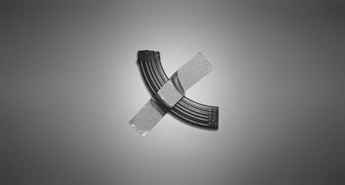 Two gun magazines taped together in a cross shape