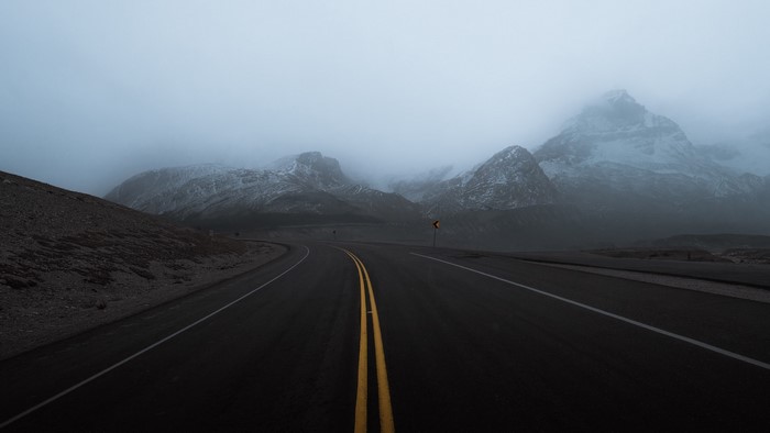 Road through misty mountains
