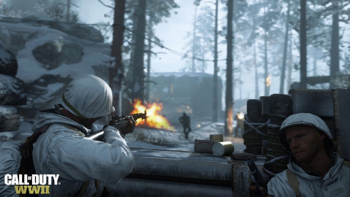 Soldiers in Call of Duty: WWII engage in combat in a snowy forest
