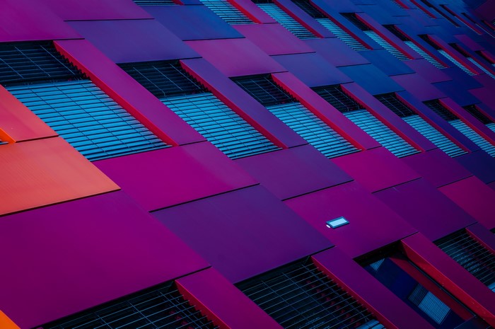 Modern building facade with purple and orange panels
