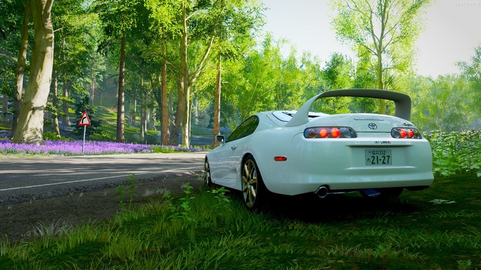White Toyota Supra in a forest road in Forza Horizon 4