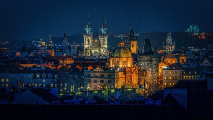 Prague cityscape at night with illuminated buildings