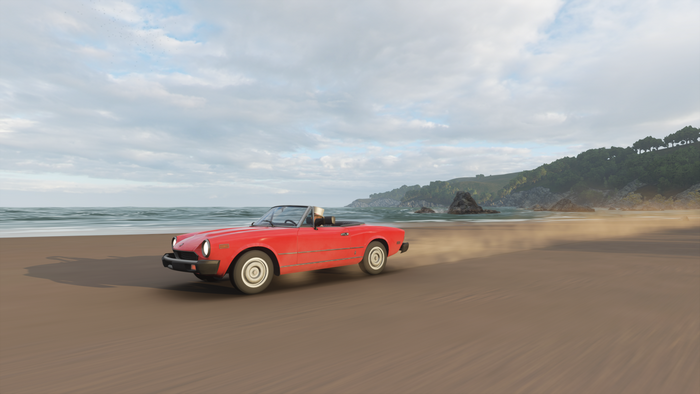 Red convertible driving on a beach in Forza Horizon 4