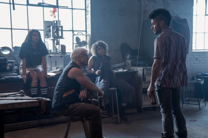Jupiter's Legacy characters in a workshop