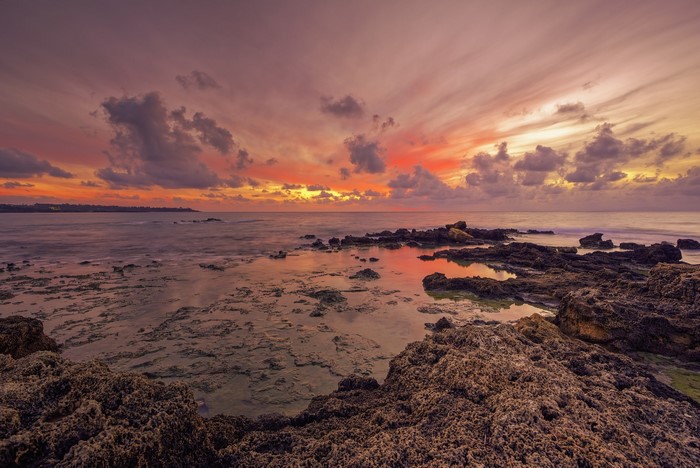 Sunset over the rocky coast of Greece