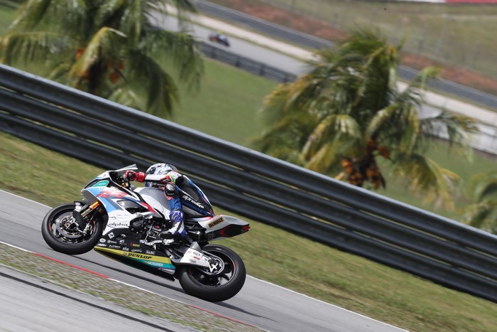 Motorcycle racer on a BMW S1000RR at a race track