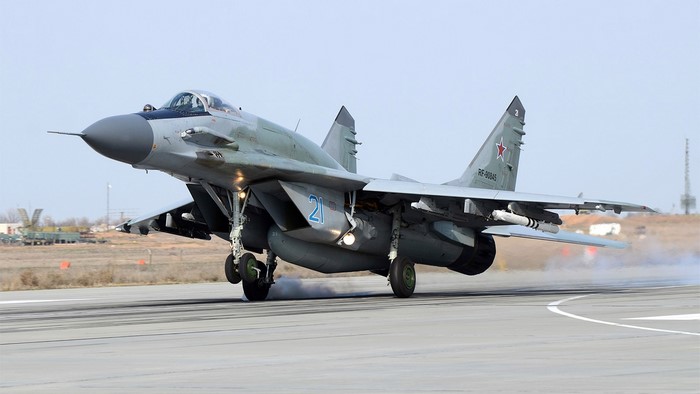 Mikoyan MiG-29 military aircraft landing on runway