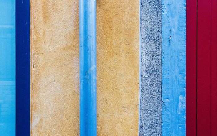 Colorful textured wall with pipe