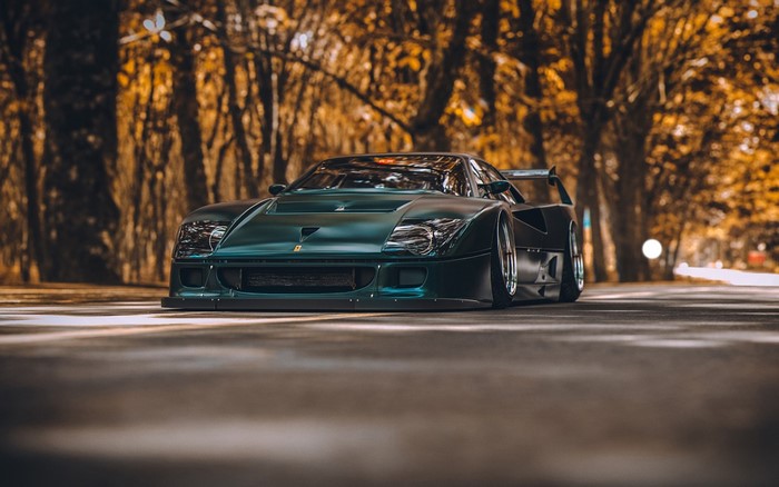 Dark Green Ferrari F40 on a Road Lined with Trees