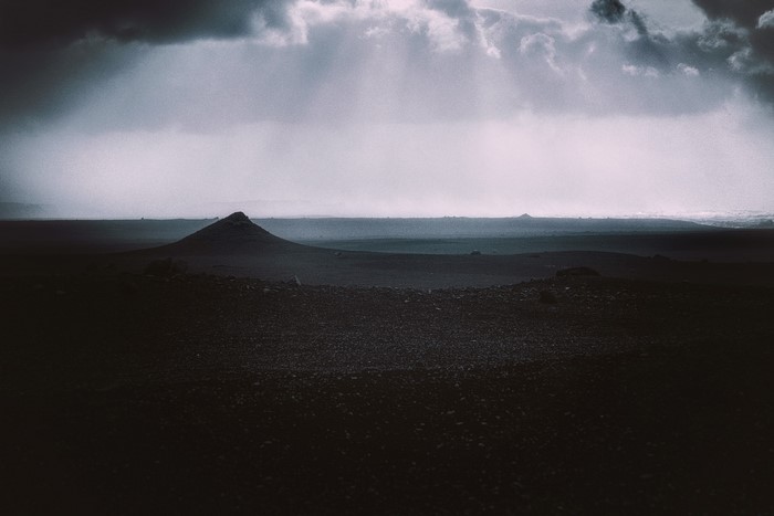 Stormy sky over a desolate volcanic landscape