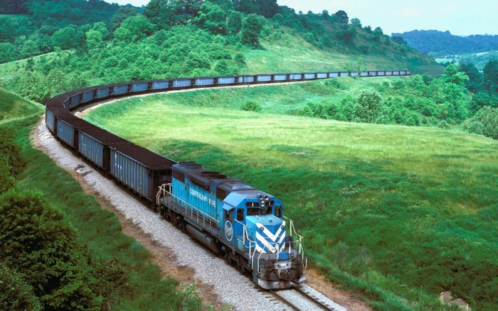 Blue train with coal cars on a curved track