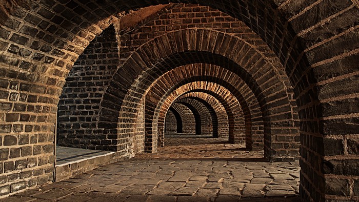 Brick hallway with repeating arches