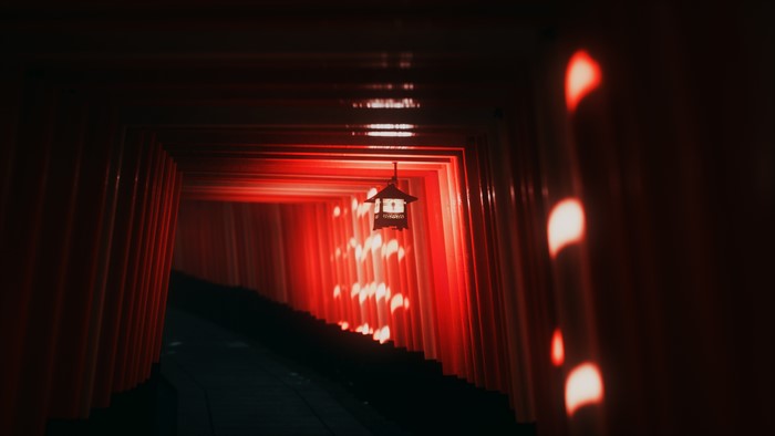 Fushimi Inari-taisha red torii path with lantern