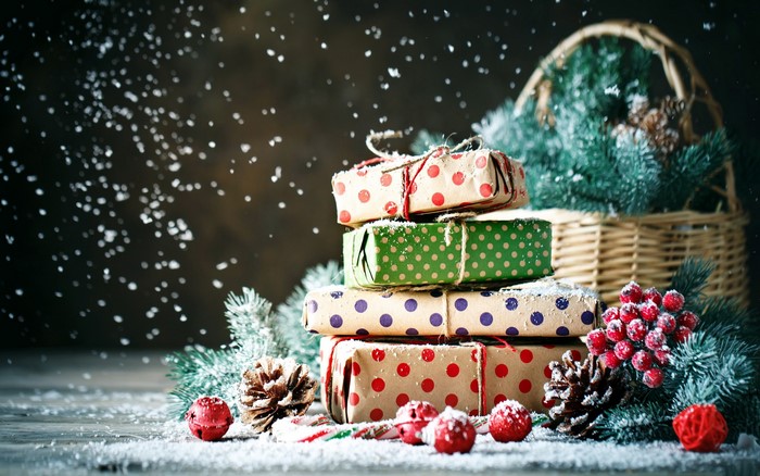 Christmas presents with snow and pine branches