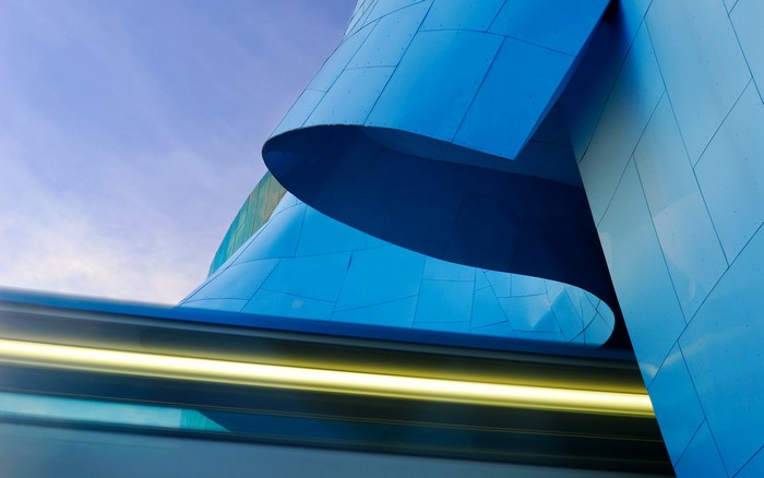 Blue metallic building with yellow light