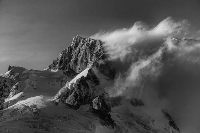 Monochrome mountain peak with clouds