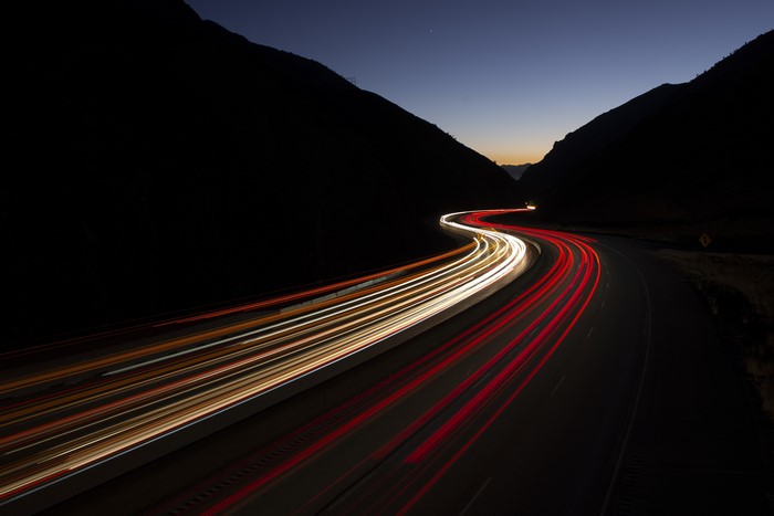 Long exposure of traffic light trails in Parleys Canyon, Utah at night
