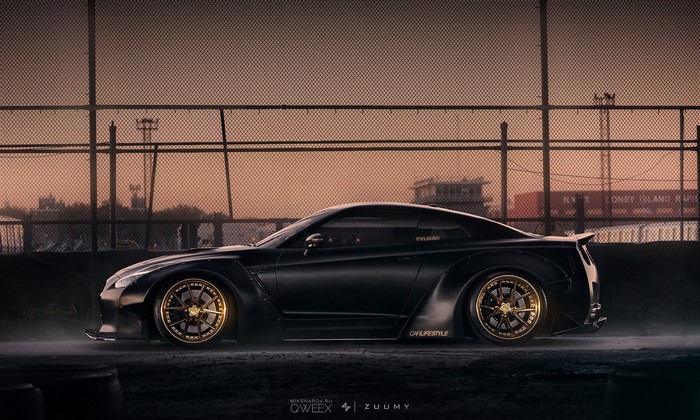 Black Nissan GT-R with gold rims