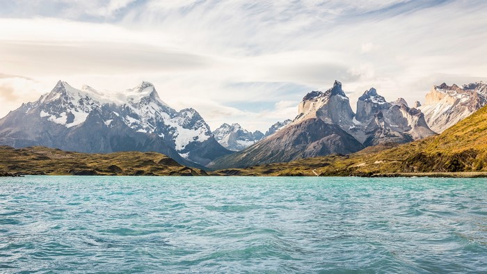 Turquoise lake and snow-capped mountains landscape