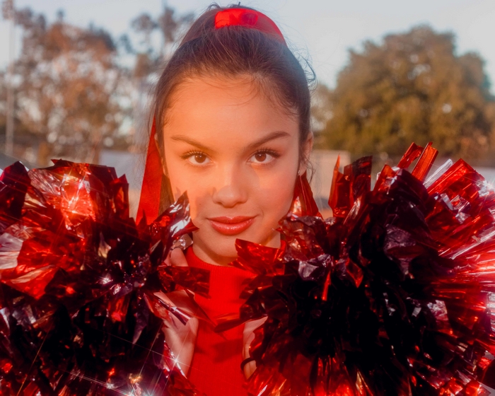 Olivia Rodrigo with red pom-poms