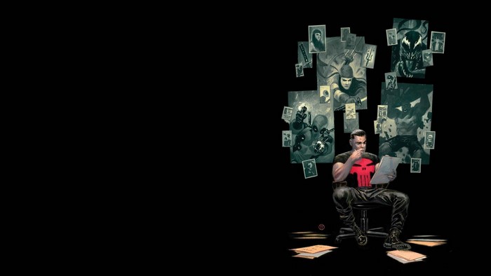 The Punisher reviewing case files with comic art on wall