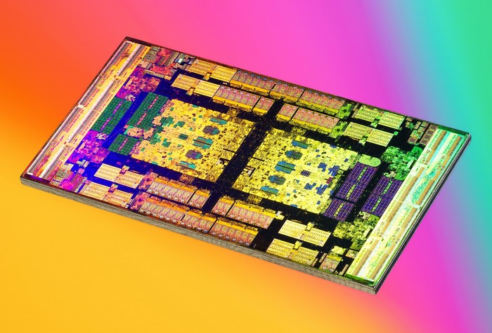 Close-up of an AMD CPU microchip with colorful integrated circuits