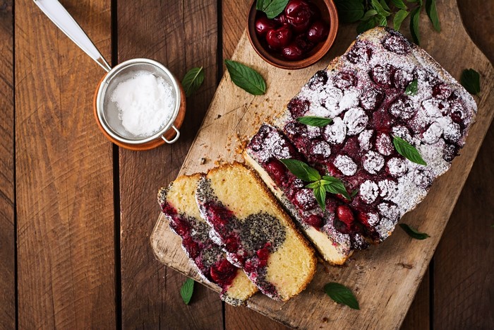 Cherry and poppy seed cake with powdered sugar