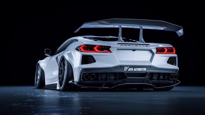 White Corvette with a large rear spoiler