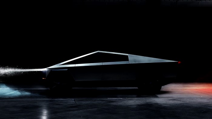 Tesla Cybertruck in a dark, futuristic setting