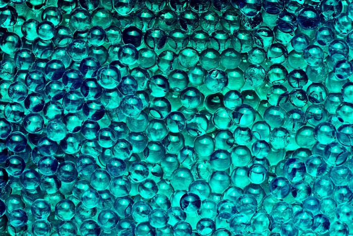 Close-up of blue and green glass marbles