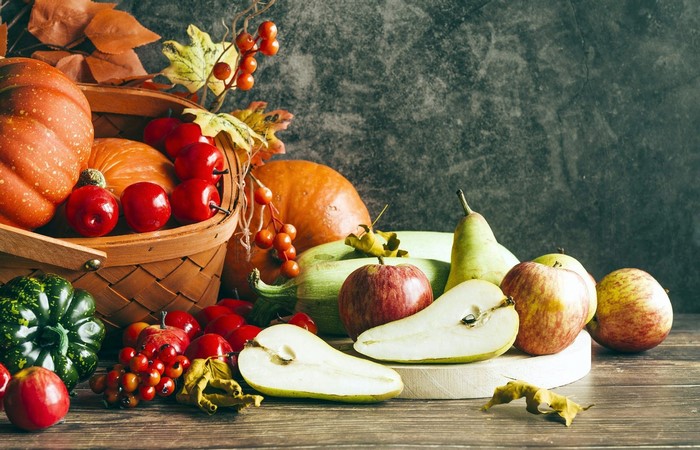 Autumn harvest still life with pumpkins, apples, and pears