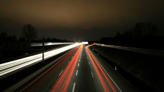 Long exposure photography of a highway at night