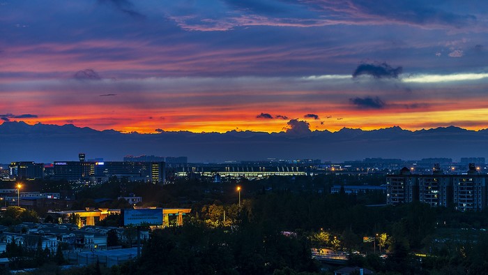 Cityscape at sunset with mountains in Sichuan