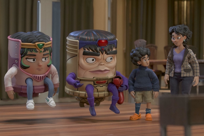 M.O.D.O.K. and family in a room