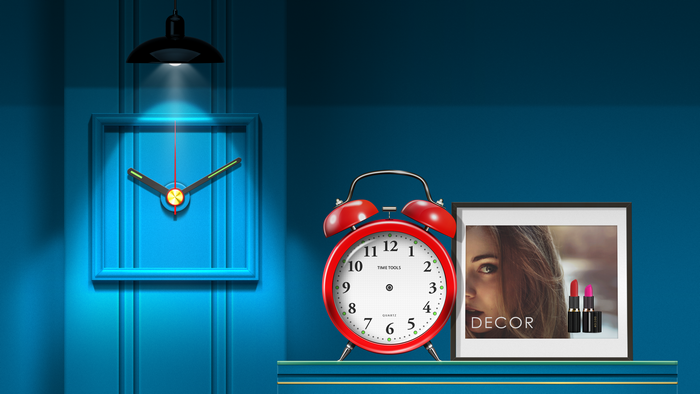Alarm clock and framed picture with lipstick on shelf