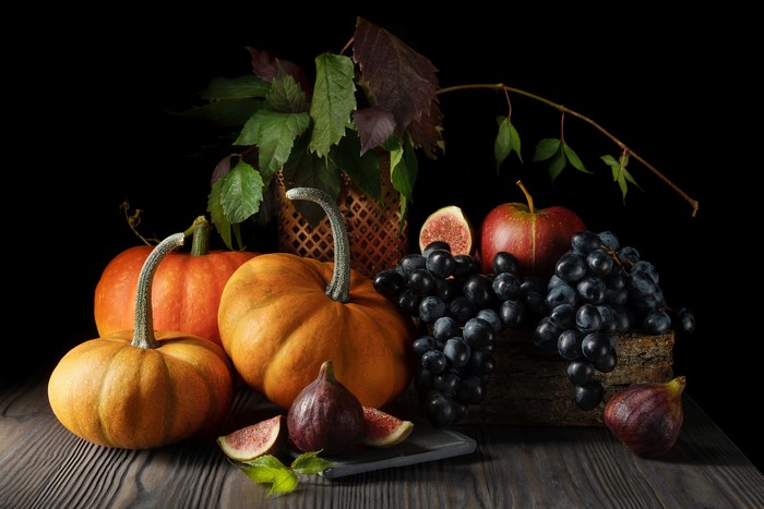 Still life with pumpkins, apples, grapes, and figs