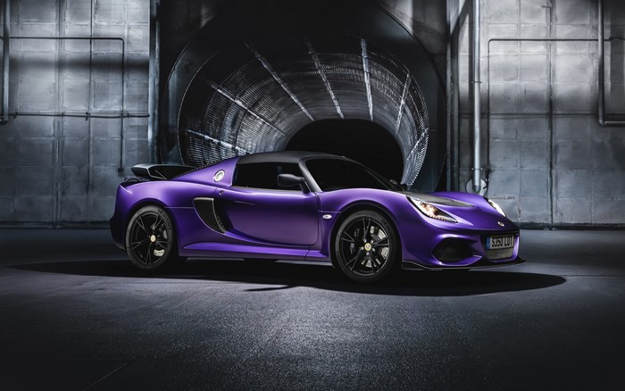 Purple Lotus Exige Sport car in industrial setting