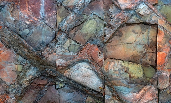 Close-up of colorful rock formations with intricate textures