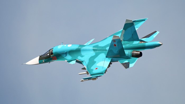 Sukhoi Su-34 fighter jet in turquoise camouflage