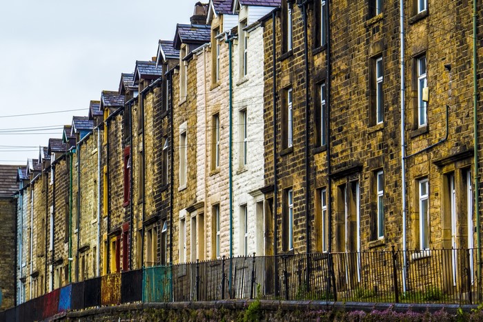 Row of terraced houses with colorful fences