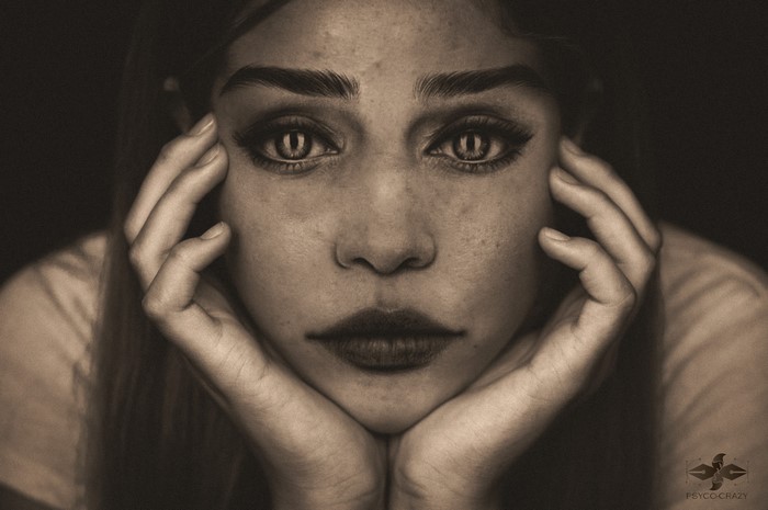Monochrome portrait of a woman with cat-like eyes