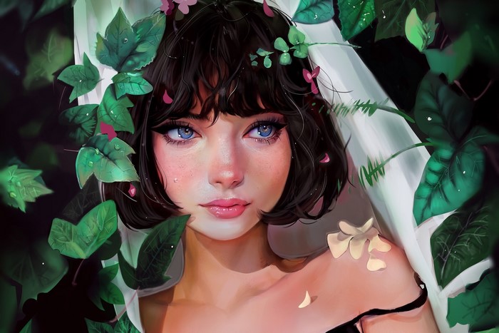 Woman with blue eyes surrounded by green leaves