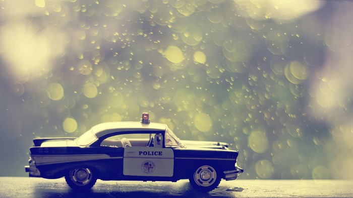 Toy police car with bokeh background
