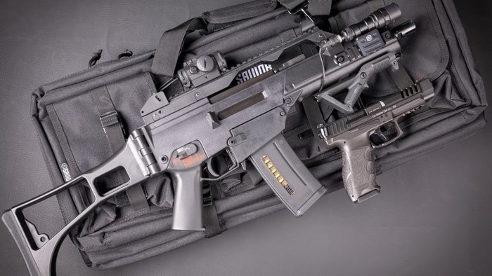 Heckler & Koch G36 rifle and pistol on a bag