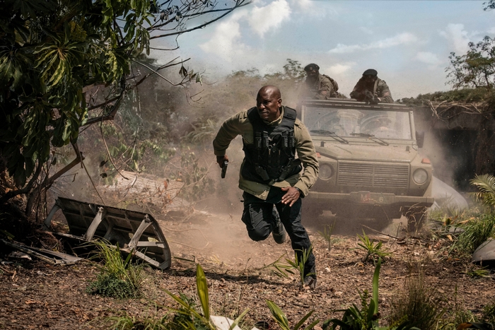 Roman Pearce running with gun in Fast and Furious 9