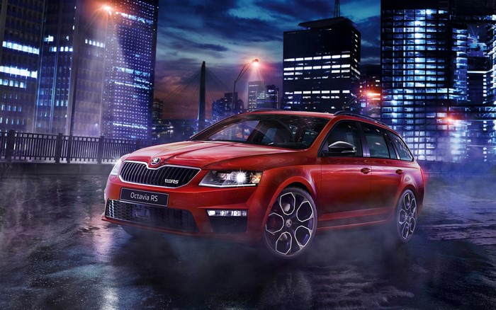 Red Skoda Octavia RS car at night in a city