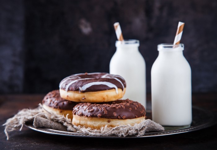 Chocolate donuts with milk bottles
